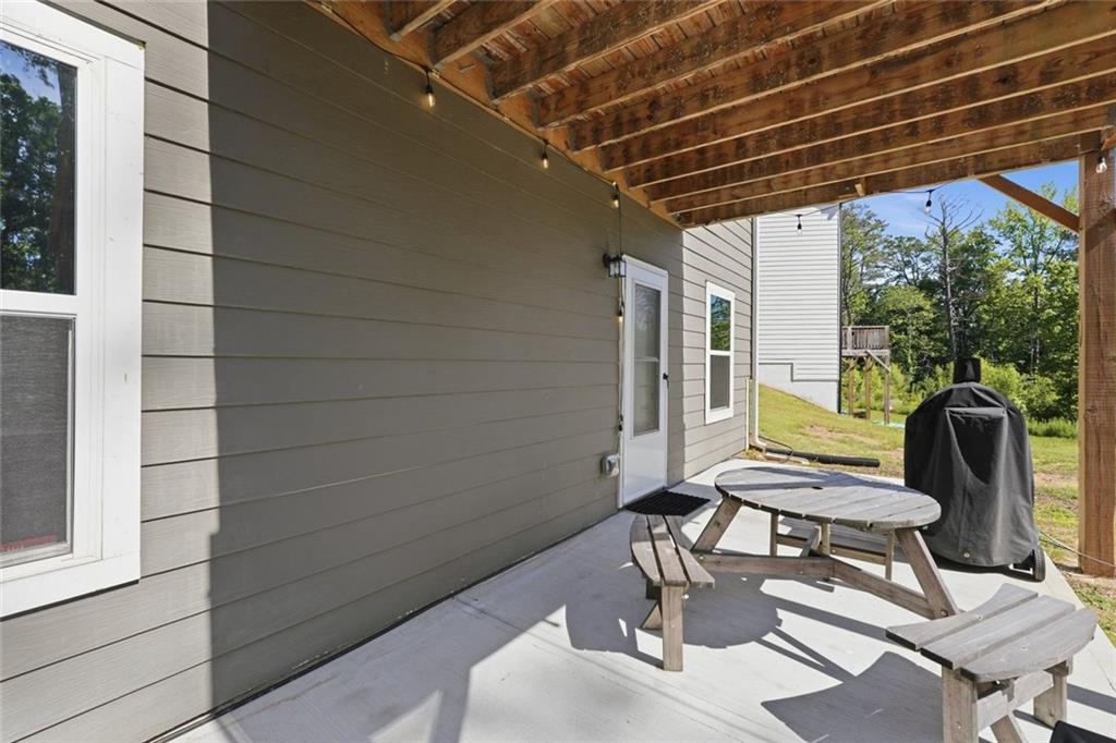 166 Ashbridge Lane Dallas, GA 30132 - Photo 28 of 35 a view of a chairs and table in patio