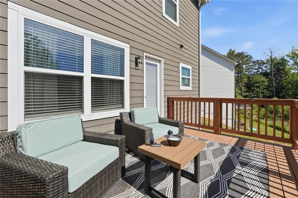 166 Ashbridge Lane Dallas, GA 30132 - Photo 30 of 35 a balcony with furniture and a potted plant