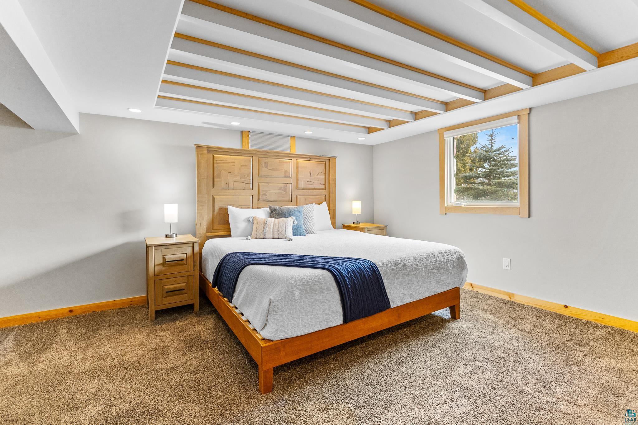 5163 Greenwood Road Duluth, MN 55804 - Photo 36 of 47 Exposed beam ceiling with recessed lighting and natural wood accents