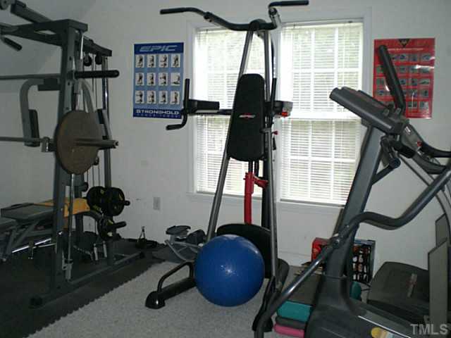 4900 Abbotts Pointe Court Raleigh, NC 27616 - Photo 17 of 25 a room with gym equipment and windows