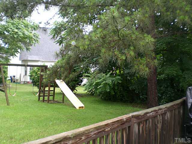 4900 Abbotts Pointe Court Raleigh, NC 27616 - Photo 23 of 25 a view of a wooden deck and a yard