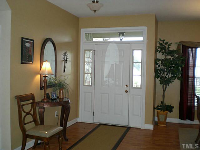 4900 Abbotts Pointe Court Raleigh, NC 27616 - Photo 3 of 25 a view of a livingroom with furniture and front door
