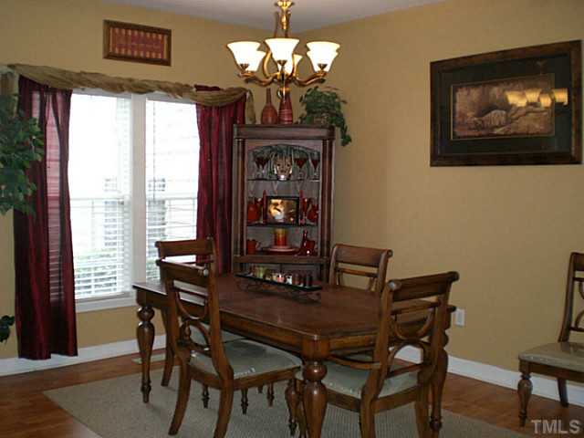 4900 Abbotts Pointe Court Raleigh, NC 27616 - Photo 5 of 25 a view of a dining room with furniture window and outside view