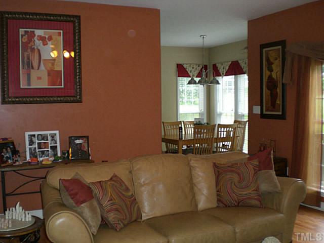 4900 Abbotts Pointe Court Raleigh, NC 27616 - Photo 9 of 25 a living room with furniture and a large window