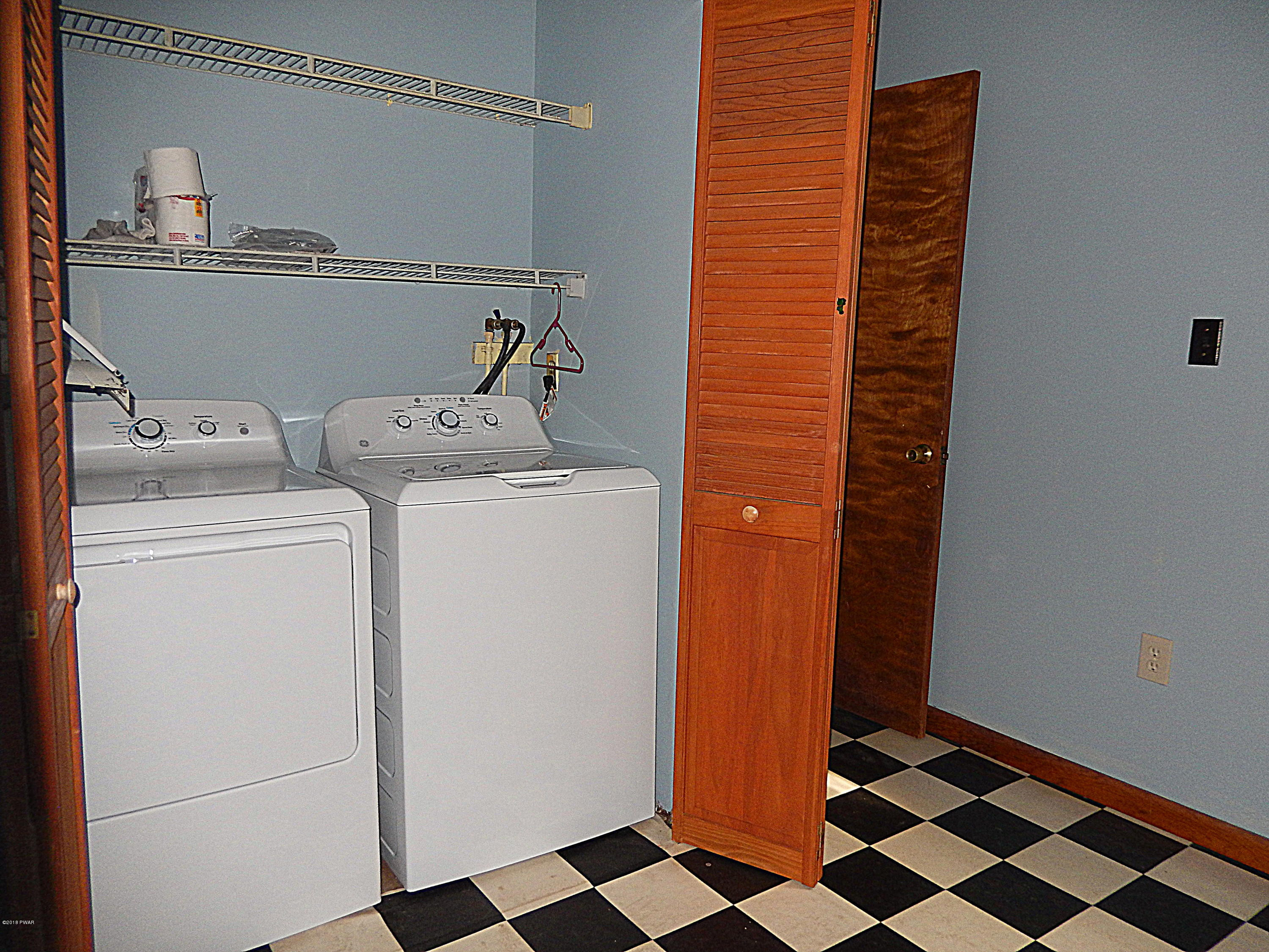 355 Ridge Avenue Hawley, PA 18428 - Photo 25 of 43 main floor laundry in bath