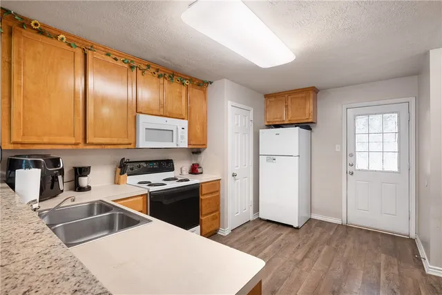 a kitchen that has a cabinets and a stove