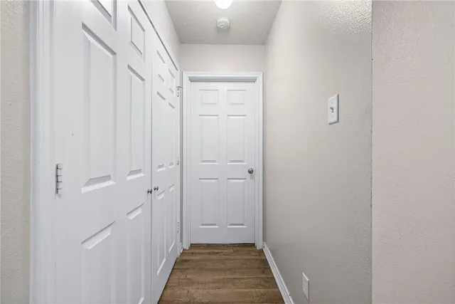 a view of a hallway with a white walls