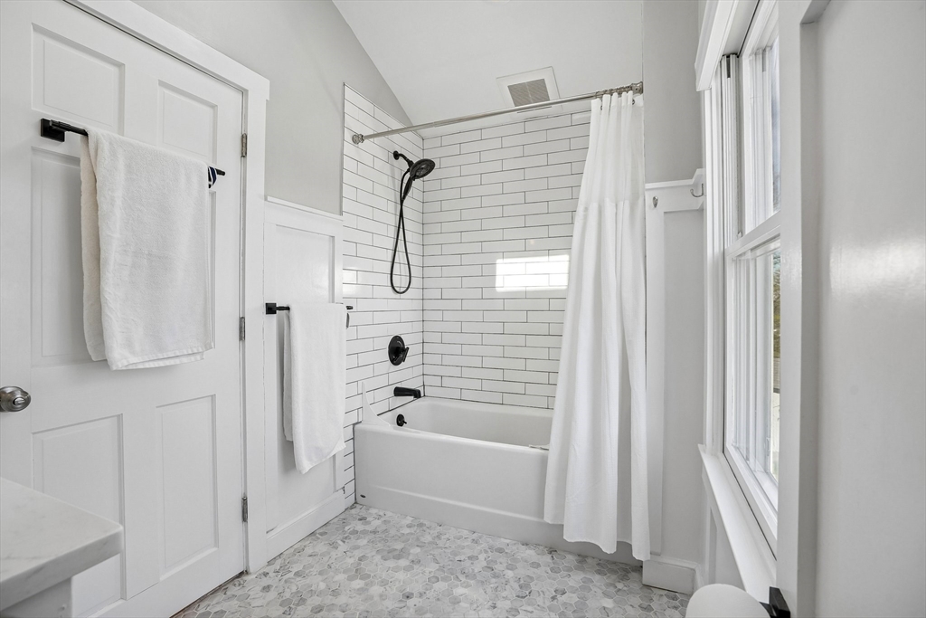 12 Hawley Road Scituate, MA 02066 - Photo 15 of 24 a bathroom with a shower bathtub and a shower