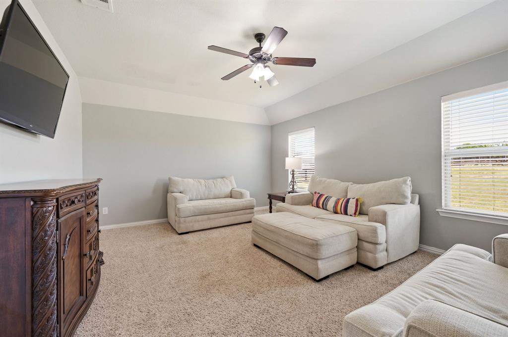 140 Heather Lane Decatur, TX 76234 - Photo 18 of 39 a living room with furniture and a flat screen tv
