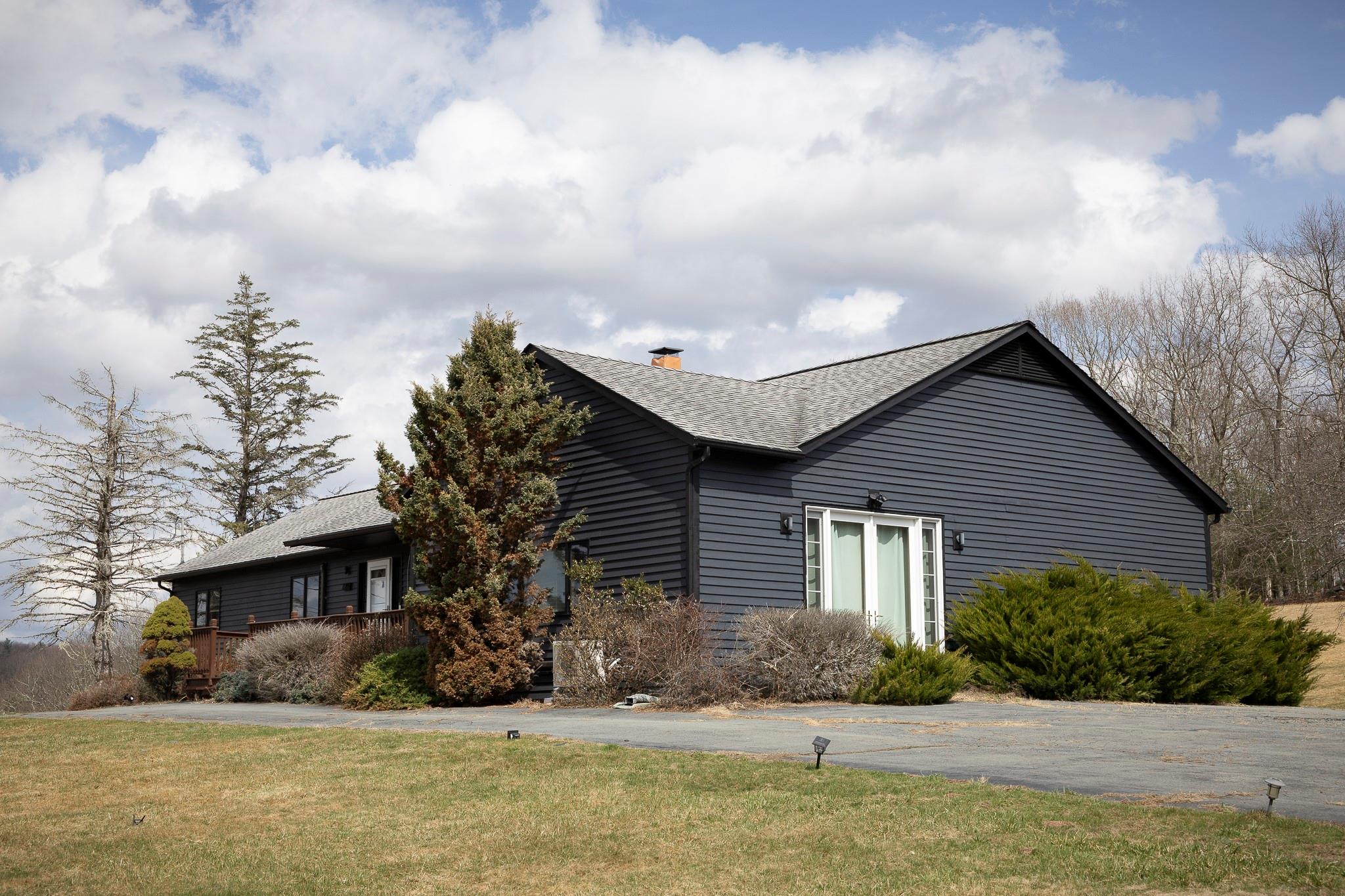 279 Kautz Road Callicoon, NY 12723 - Photo 1 of 1 View of side of home featuring a chimney, a yard, and roof with shingles