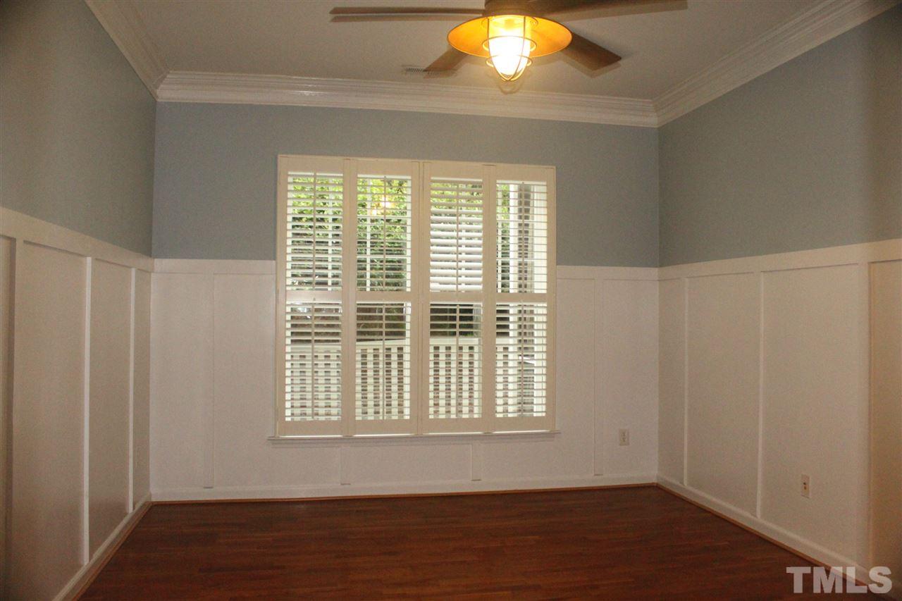 2229 Banks Hill Row Road Raleigh, NC 27614 - Photo 6 of 13 Lovely master bedrom with crown molding, board and batten and upgraded fan/ light fixture! Relax in this charming room.