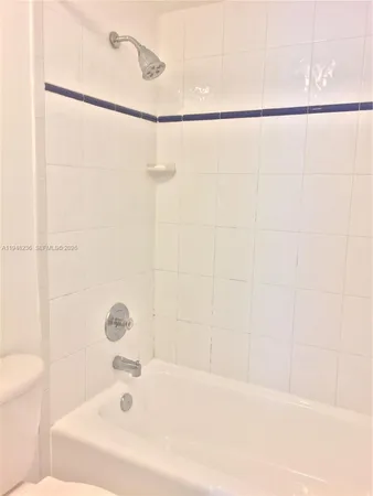 a bathroom with a shower and a bathtub