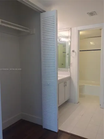 a bathroom with a shower and a sink