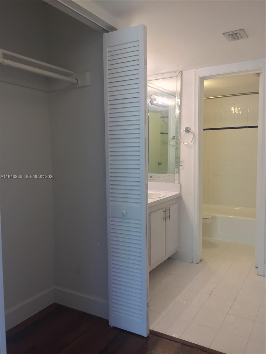 9225 Southwest 87th Avenue, Unit A8 Miami, FL 33176 - Photo 13 of 14 a bathroom with a shower and a sink