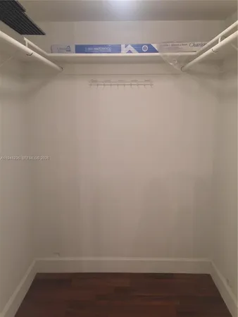a view of an empty walk in closet