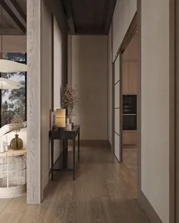 a living room with furniture a rug and a white wall