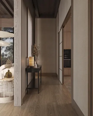 a living room with furniture a rug and a white wall