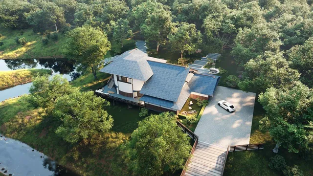 an aerial view of a house with swimming pool outdoor seating and yard