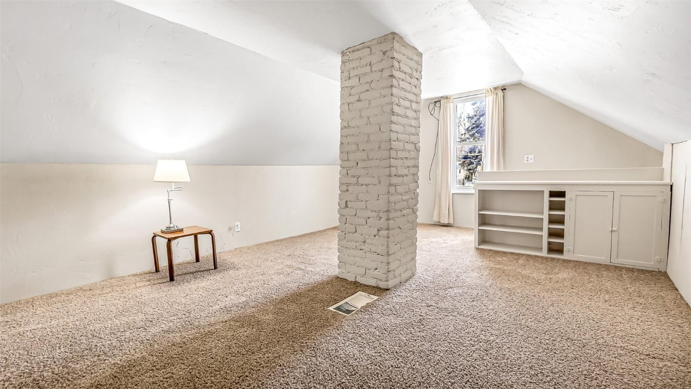 694 Russell Street Craig, CO 81625 - Photo 14 of 40 a view of an empty room with a fireplace