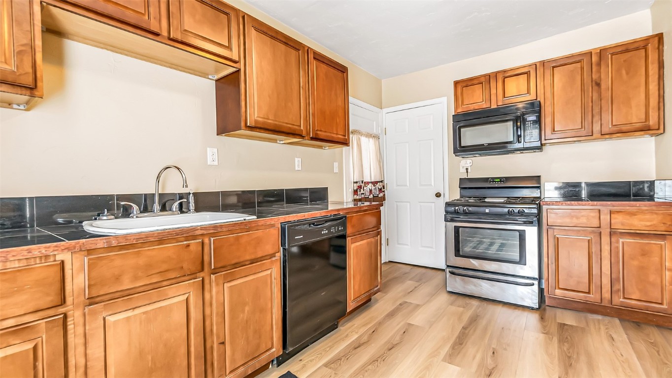 694 Russell Street Craig, CO 81625 - Photo 20 of 40 a kitchen with stainless steel appliances granite countertop a stove and a sink