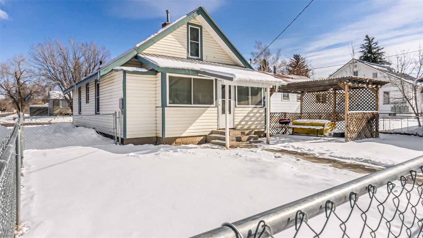 694 Russell Street Craig, CO 81625 - Photo 2 of 40 a front view of a house with a yard and garage