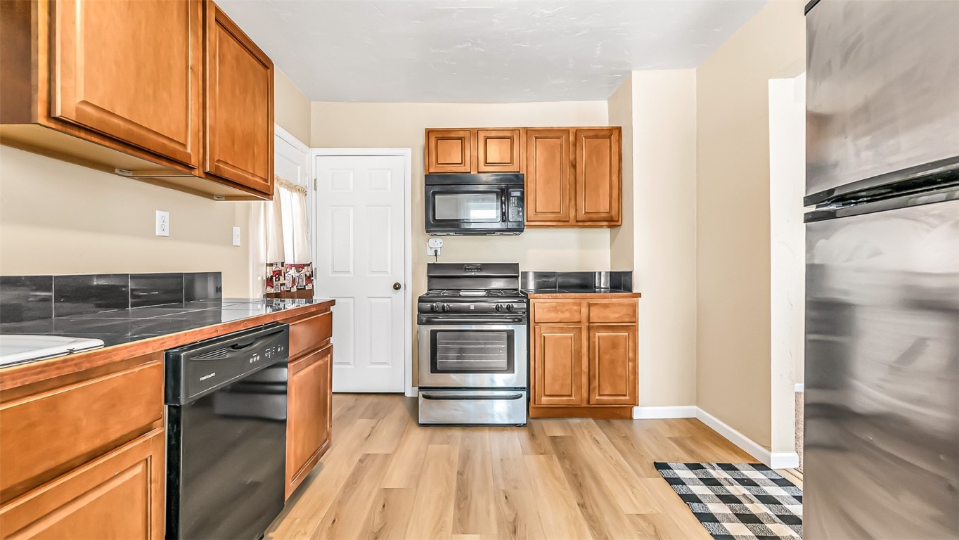 694 Russell Street Craig, CO 81625 - Photo 21 of 40 a kitchen with stainless steel appliances a stove and a refrigerator