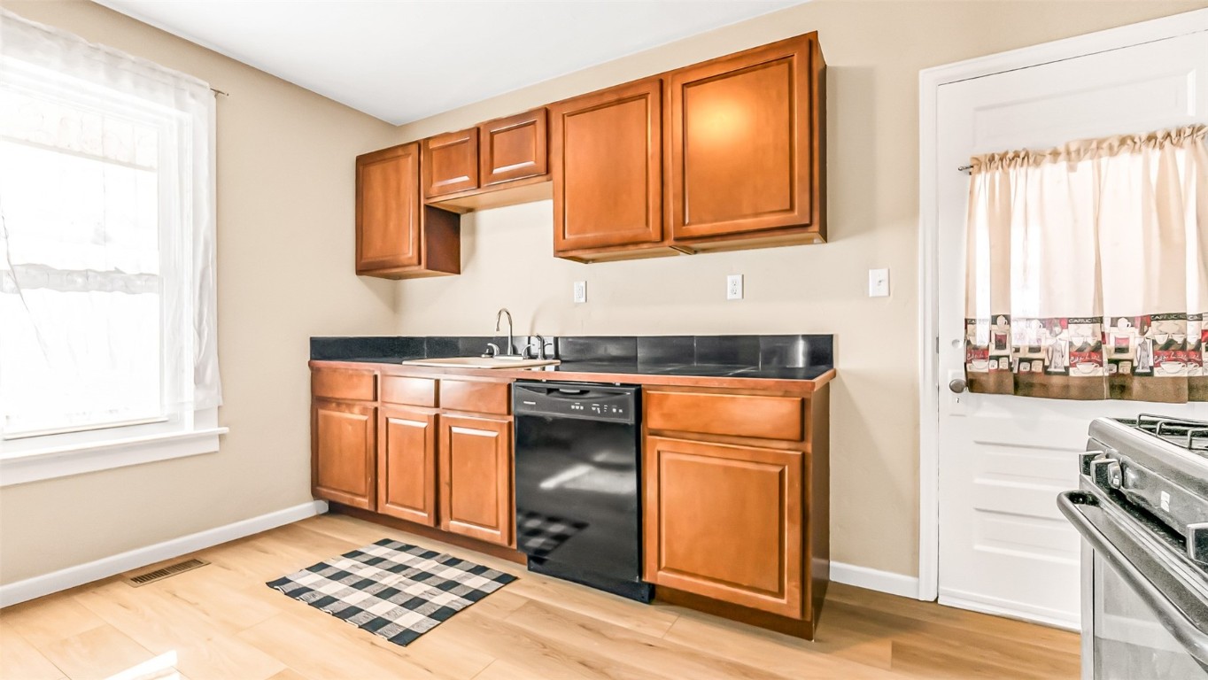 694 Russell Street Craig, CO 81625 - Photo 22 of 40 a kitchen with stainless steel appliances granite countertop a stove a sink and a refrigerator