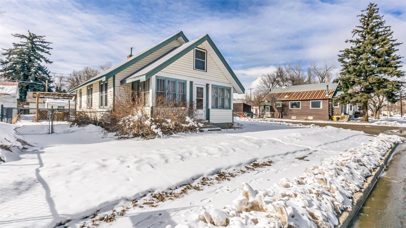 694 Russell Street Craig, CO 81625 - Photo 40 of 40 a front view of a house with a yard covered with snow