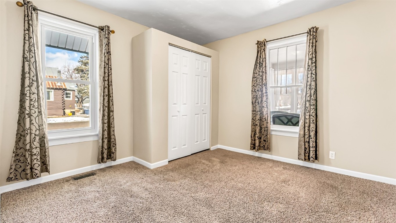 694 Russell Street Craig, CO 81625 - Photo 5 of 40 an empty room with windows