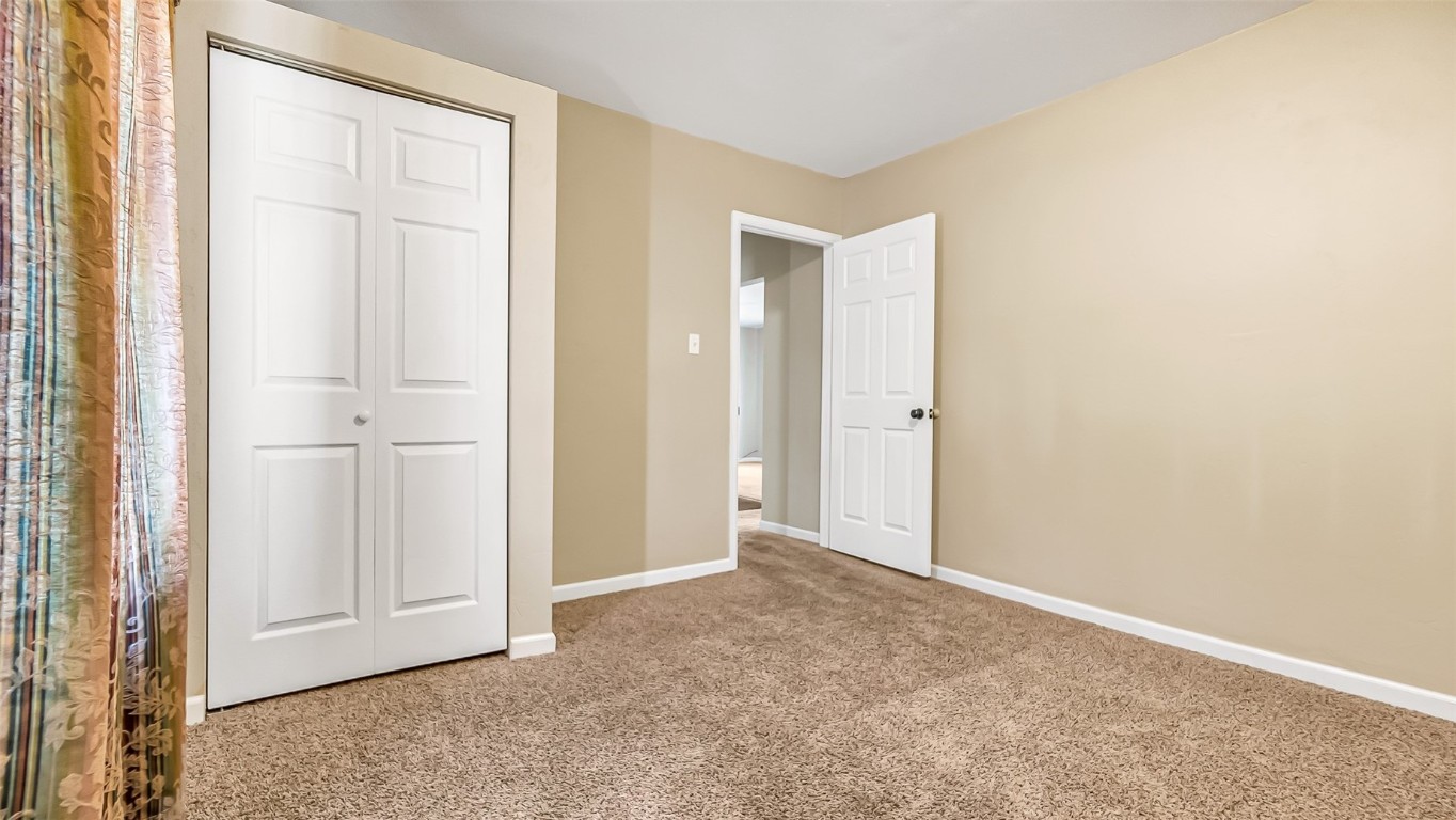 694 Russell Street Craig, CO 81625 - Photo 9 of 40 an empty room with windows and closet