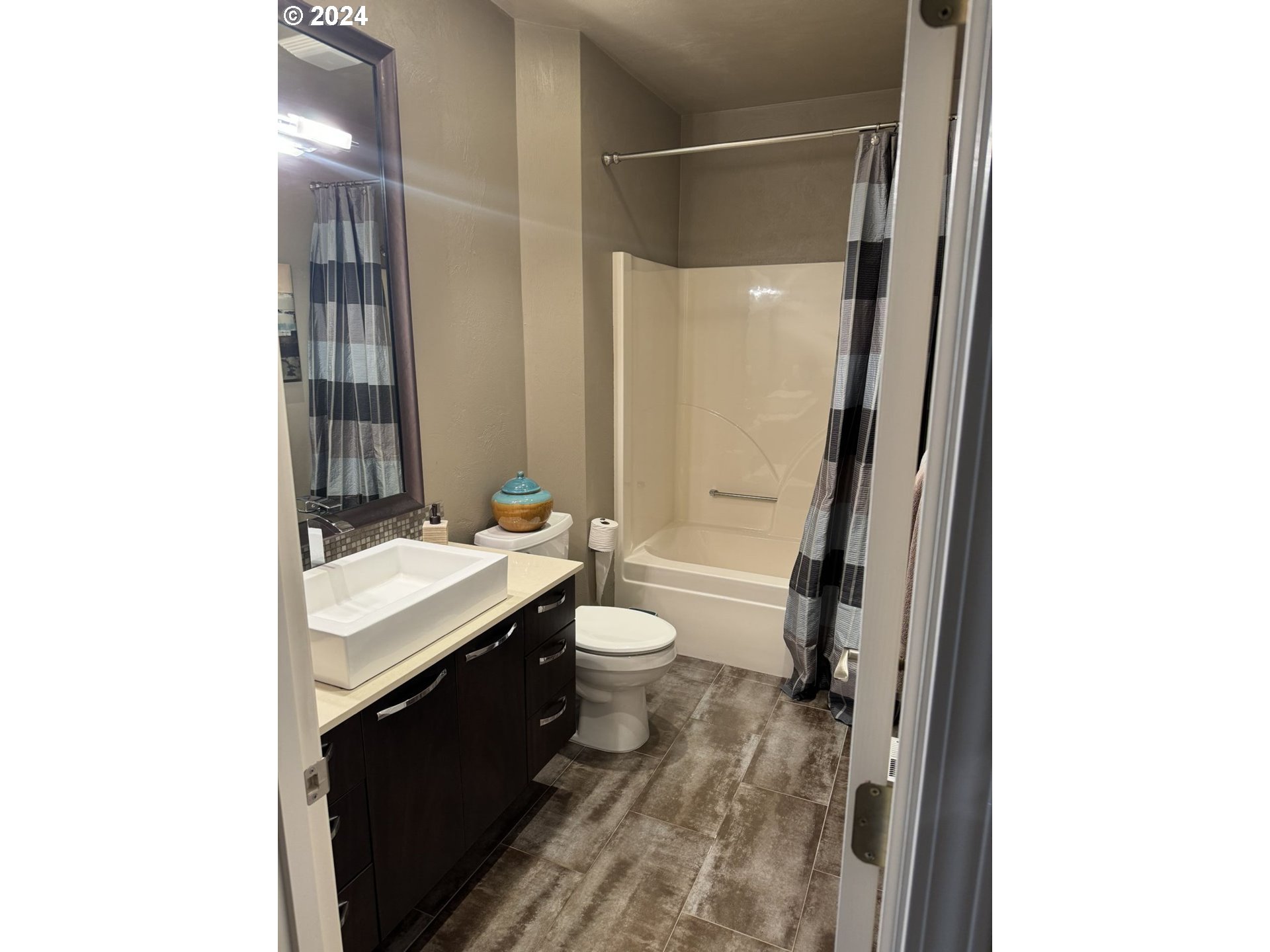 990 Old Orchard Lane Springfield, OR 97477 - Photo 15 of 16 a bathroom with a granite countertop sink toilet and shower