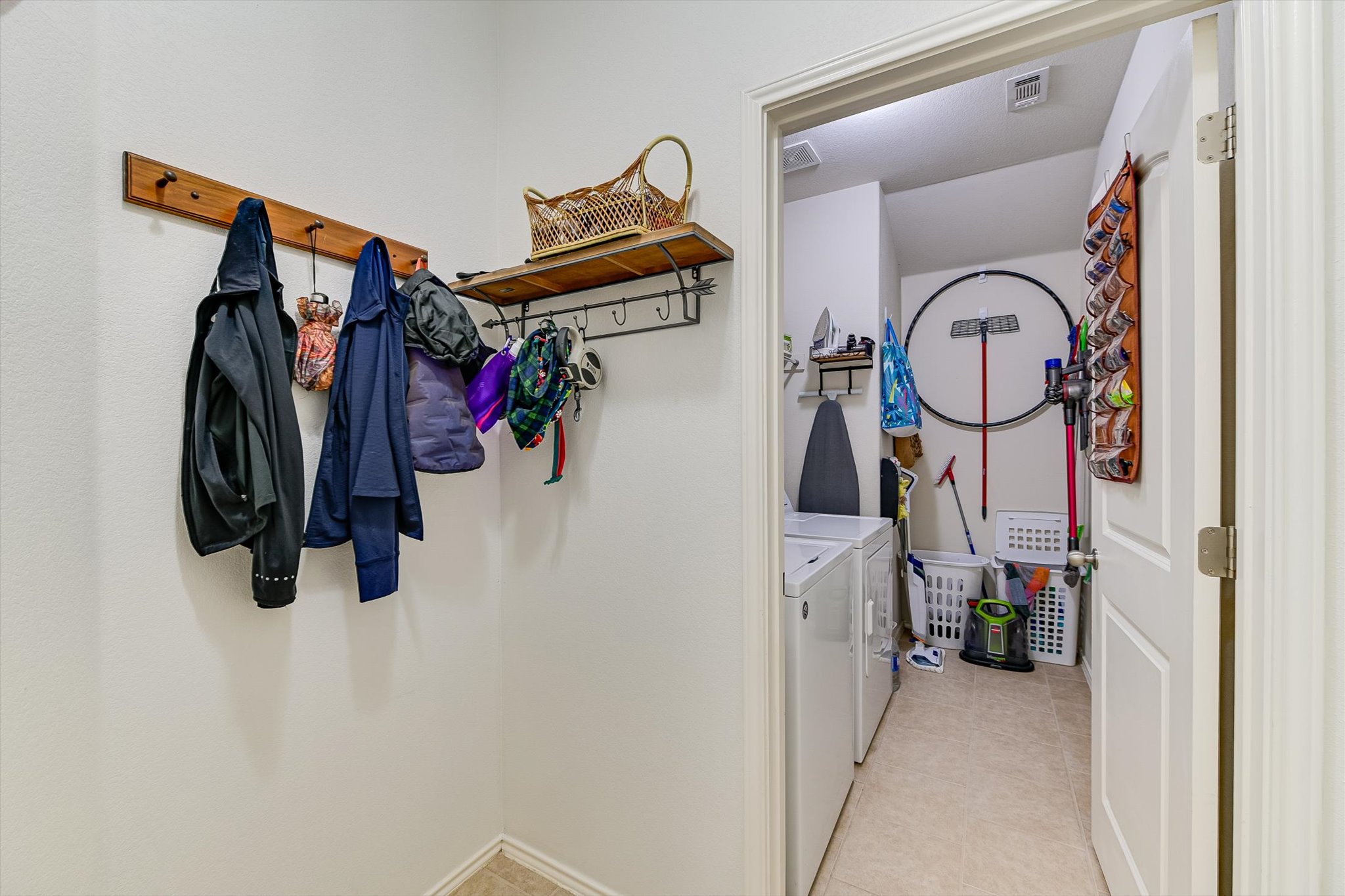 536 Dragon Ridge Road Buda, TX 78610 - Photo 10 of 20 Laundry area featuring a side-by-side washer and dryer, tile flooring, and overhead lighting