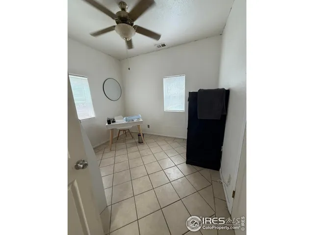 a living room with a sink and a mirror