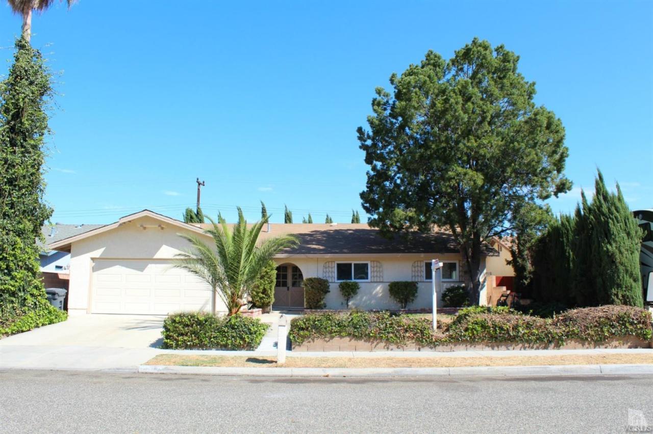 5317 Mildred Street Simi Valley, CA 93063 - Photo 1 of 16 a view of a house with a tree in the background