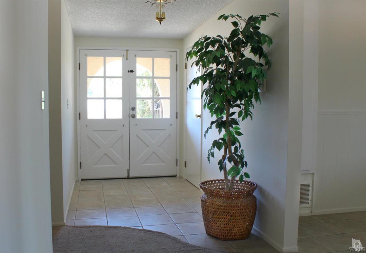 5317 Mildred Street Simi Valley, CA 93063 - Photo 2 of 16 a view of a potted plant in a room next to a window