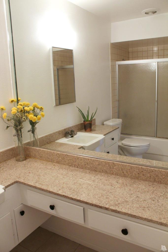 5317 Mildred Street Simi Valley, CA 93063 - Photo 11 of 16 a bathroom with a sink and a mirror