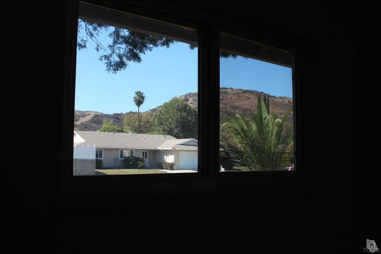 5317 Mildred Street Simi Valley, CA 93063 - Photo 12 of 16 a view of a back yard from a window