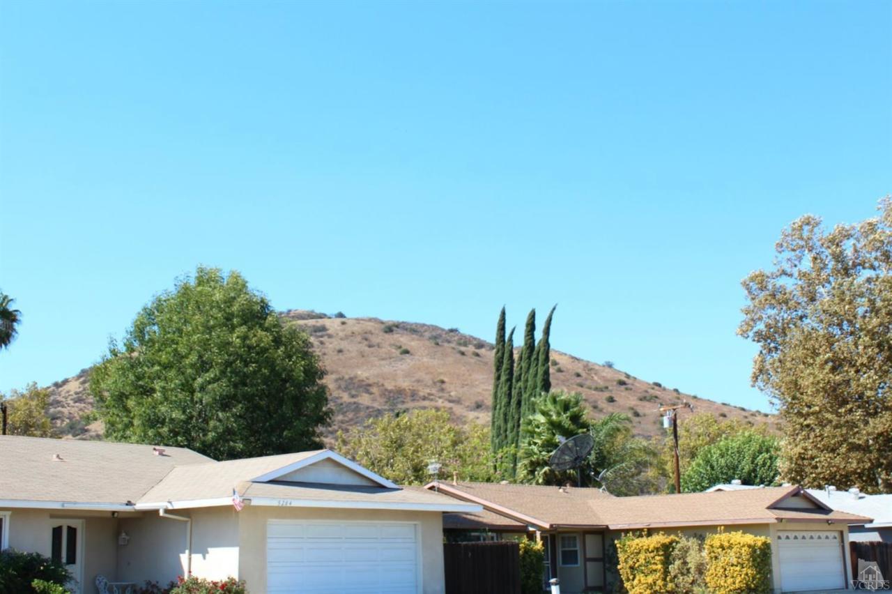 5317 Mildred Street Simi Valley, CA 93063 - Photo 14 of 16 a backyard of a house with large trees