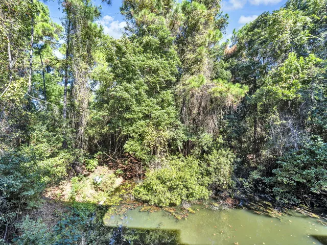 a view of a lake with a yard