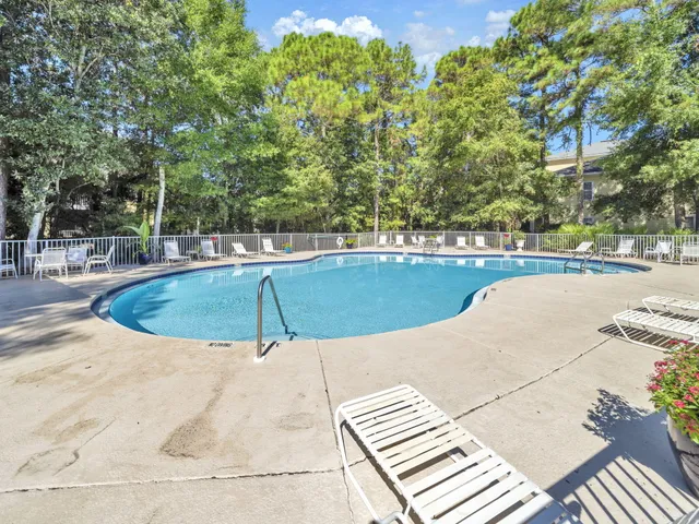 a view of a swimming pool with a patio