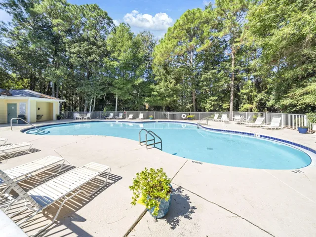 a view of a swimming pool with a patio