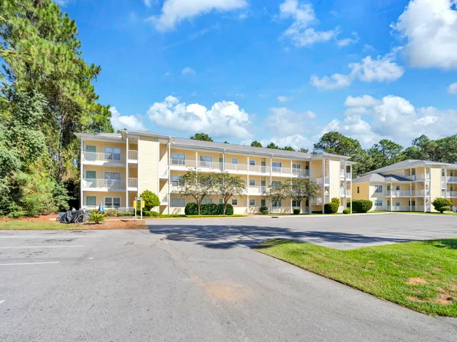 a city view with tall buildings and a yard