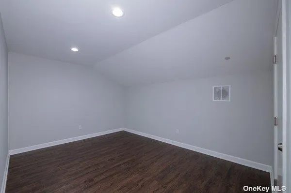 a view of room with wooden floor
