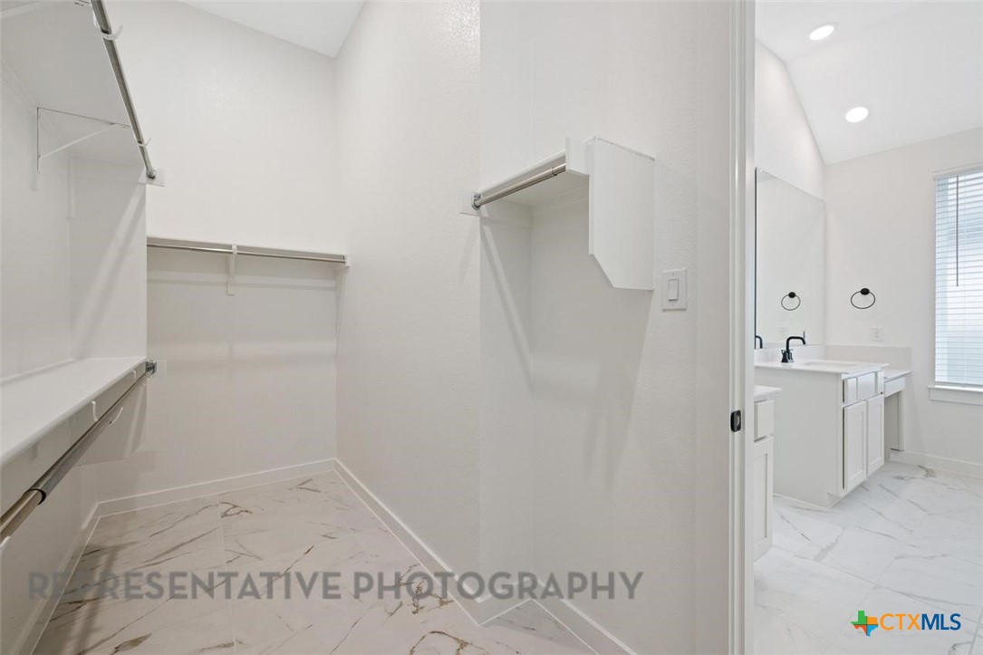120 Fox Run Georgetown, TX 78628 - Photo 11 of 30 a bathroom with a shower and a sink