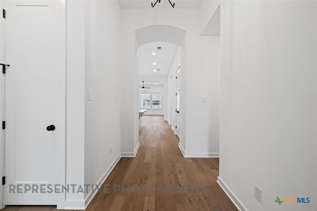 120 Fox Run Georgetown, TX 78628 - Photo 12 of 30 a view of a hallway with wooden floor