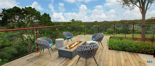 a view of a chair and table on the wooden floor