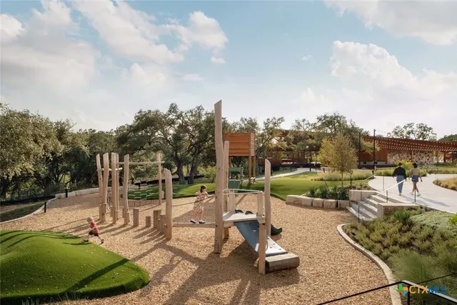 a view of a swimming pool and lounge chairs