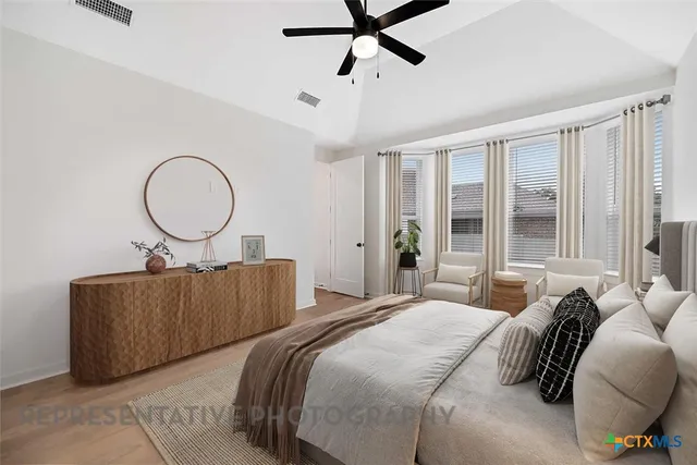 a bedroom with bed and a window