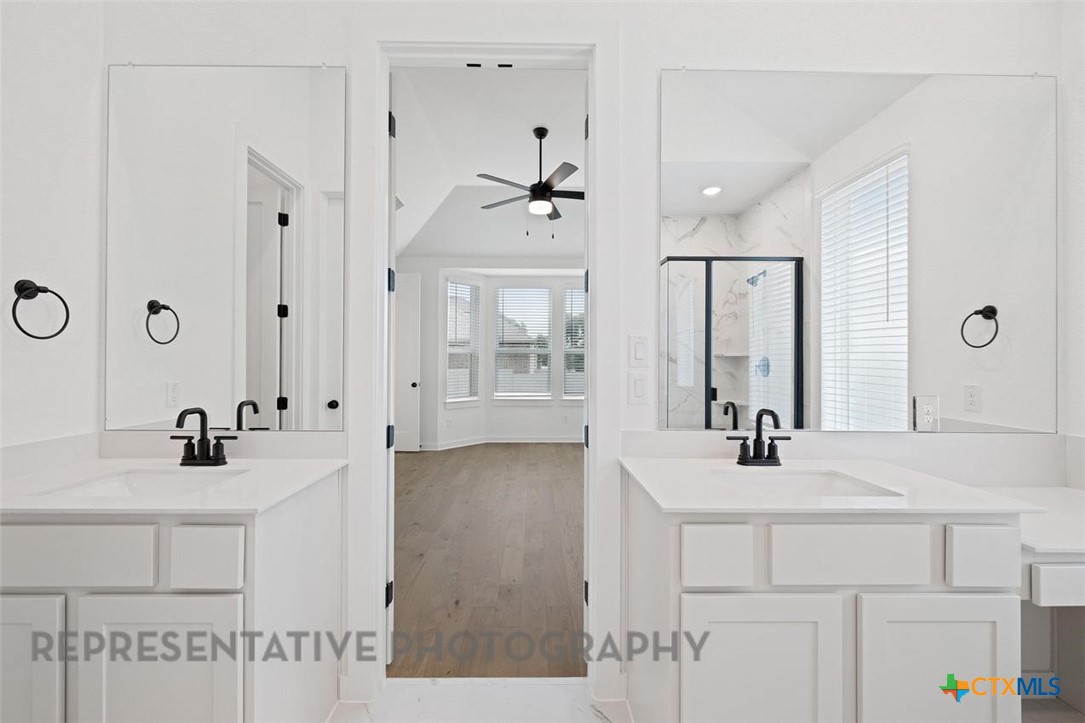 120 Fox Run Georgetown, TX 78628 - Photo 10 of 30 a bathroom with a sink and a mirror