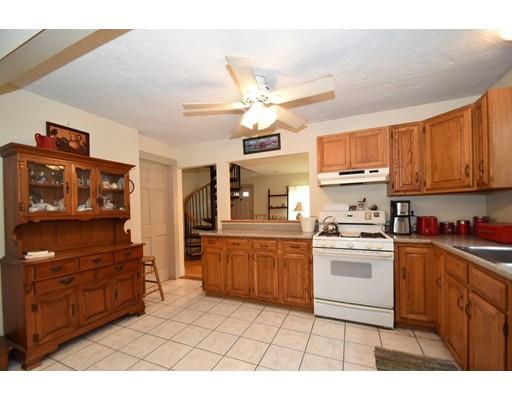 33 Wyola Road Hull, MA 02045 - Photo 3 of 16 a kitchen with stainless steel appliances granite countertop a sink and cabinets
